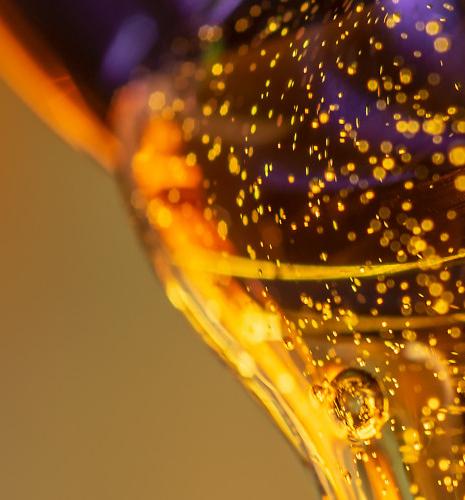 Golden liquid poured from a jar