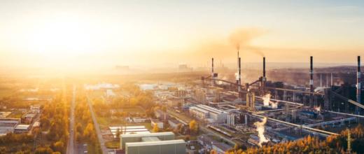 Sunrise landscape with factories in the background